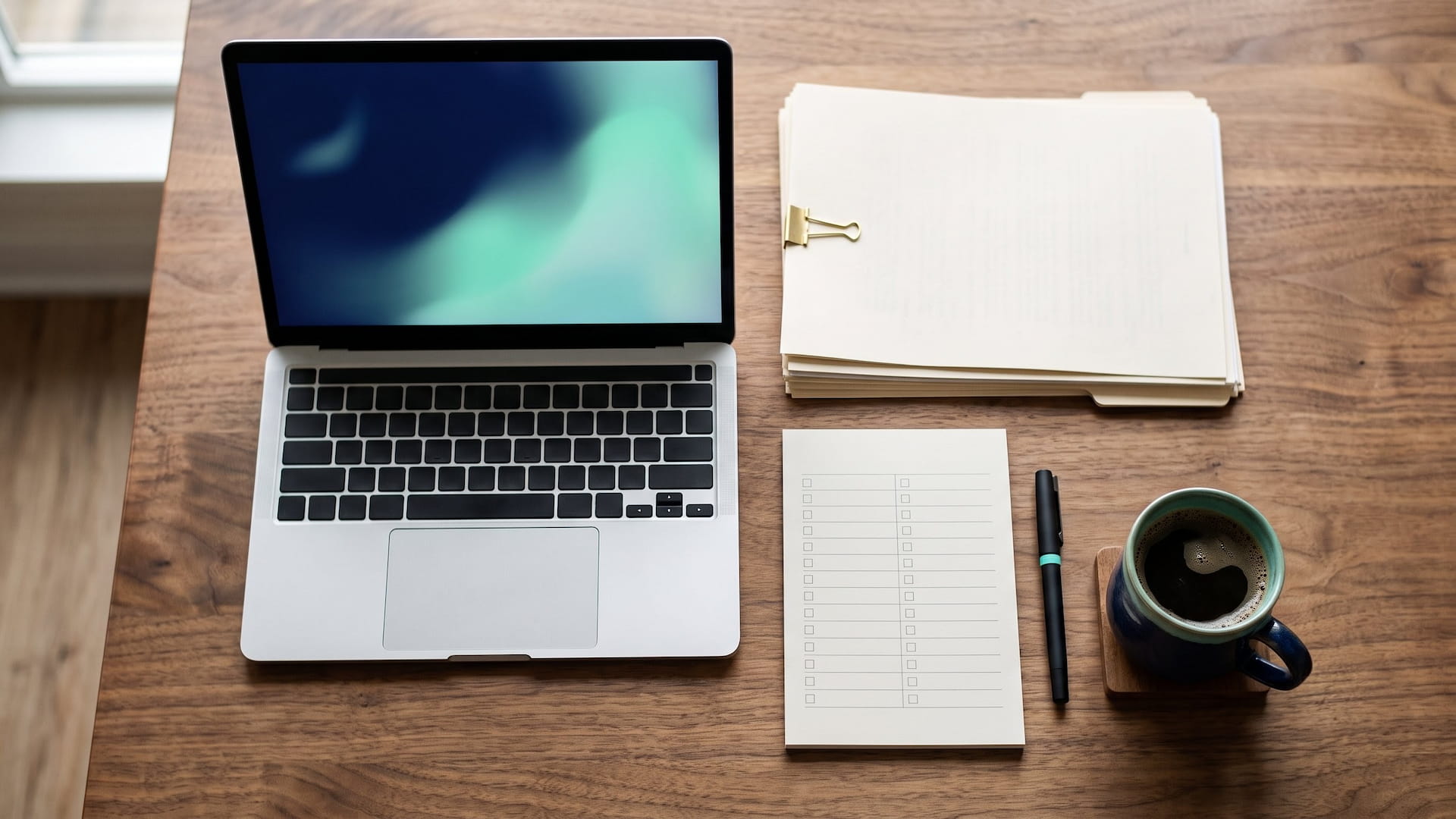 Audit preparation desk with laptop, checklist and documents